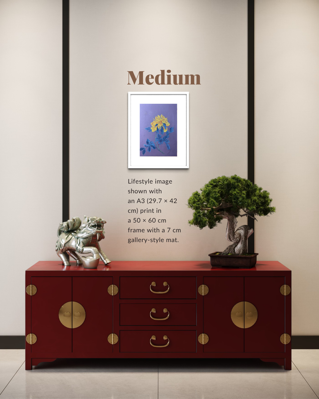 A framed art print displayed on a wall above a red wooden cabinet, with text indicating the print is medium size (29.7 x 42 cm) and shown in a lifestyle setting alongside a bonsai tree and a silver statue.