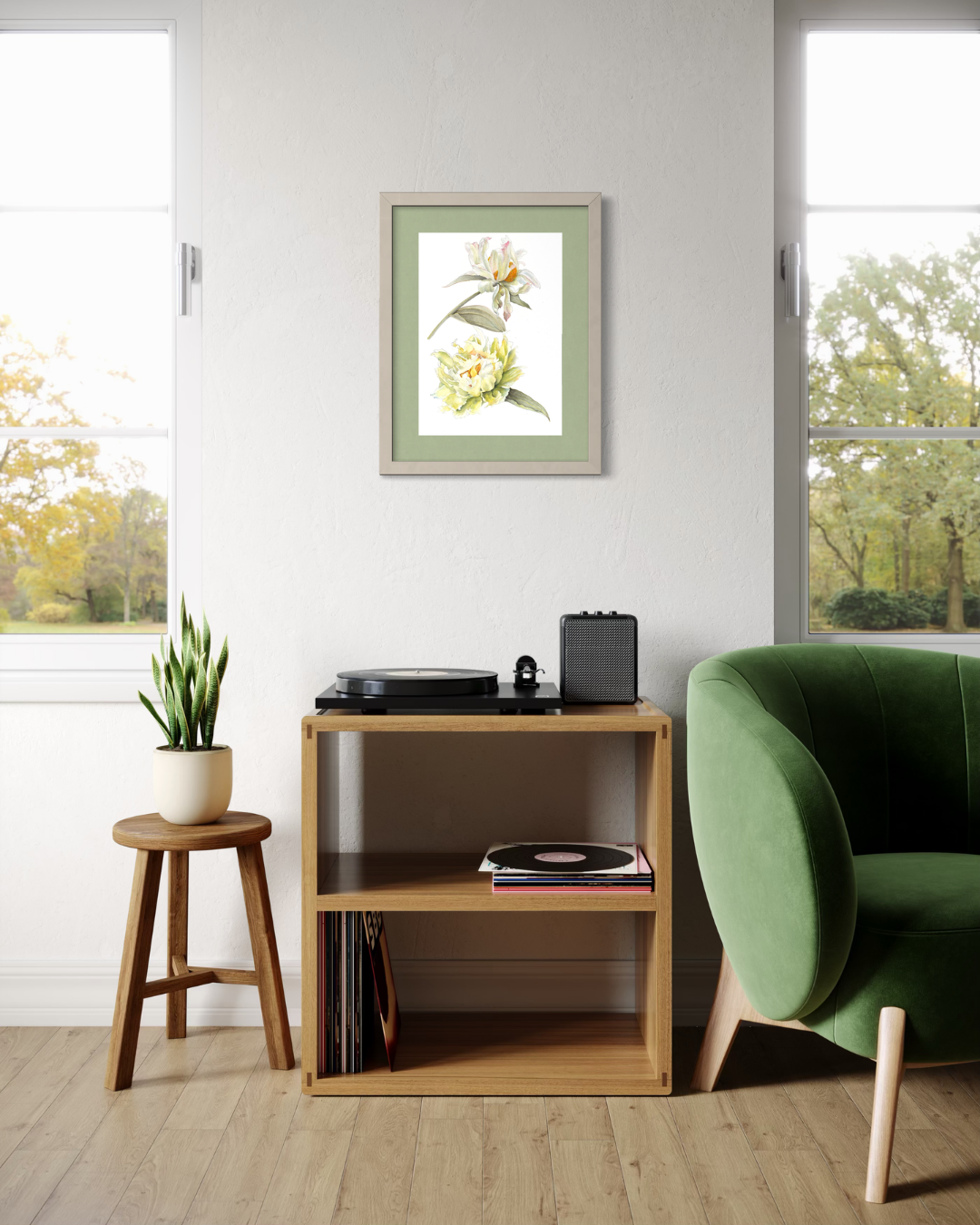A framed botanical art print of yellow flowers with green leaves, displayed on a white wall in a modern living room setting above a wooden shelf.