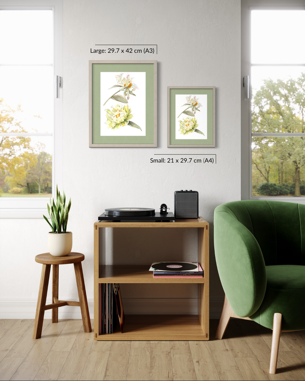 Two framed botanical art prints with white flowers and green leaves are displayed on a light gray wall in a styled room. One print is labeled as large (29.