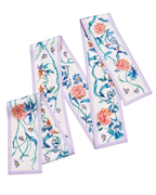 A set of three white satin or silk ribbon trims with a delicate floral and butterfly pattern, featuring light purple borders and embroidered details, arranged on a plain white background.