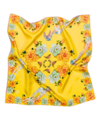 A square silk scarf with a vibrant yellow background, featuring a symmetrical floral and bird pattern in orange, green, and blue.