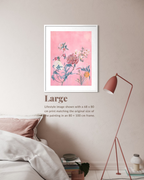 A framed floral art print with a pink background hangs on a beige wall above a bed in a styled bedroom. The print shows blue, white, and orange flowers with botanical details.