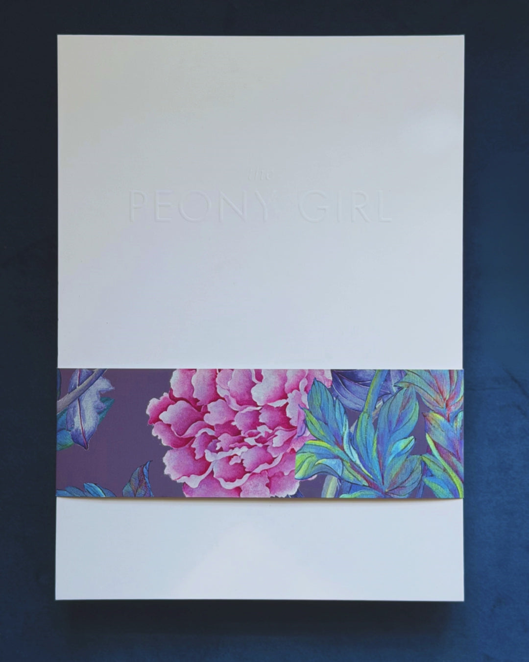 Unboxingluxury silk scarf to show the painting behind the design, authenticity certificate, silk detail and handrolled hemming