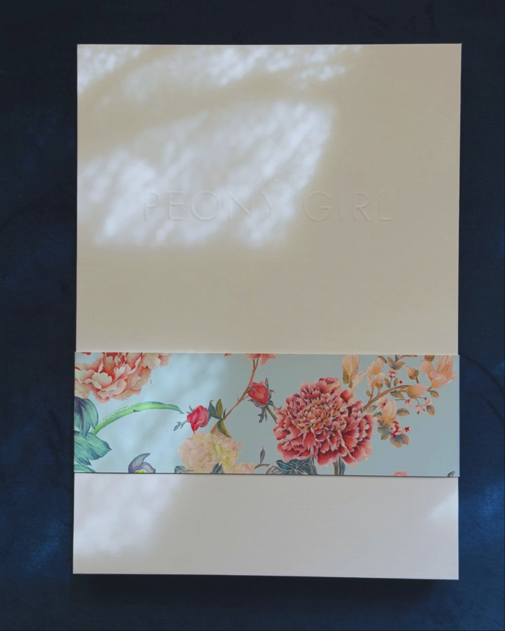 Unboxing a luxury silk shawl with details and handrolled hemming